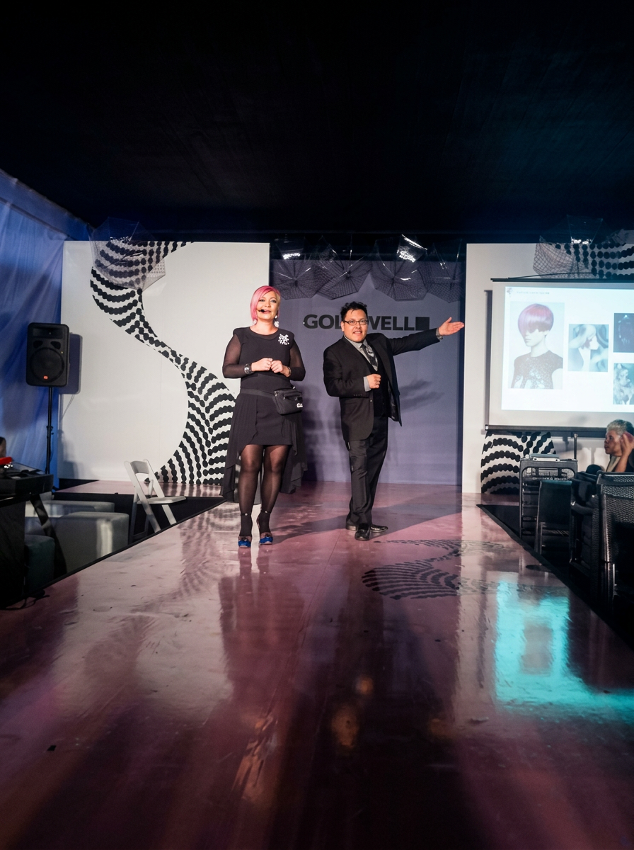 Jesús Carrasco presenting on stage at a Goldwell hair show
